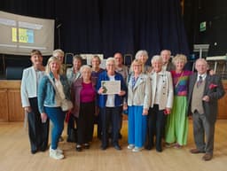 Monday club volunteers with award